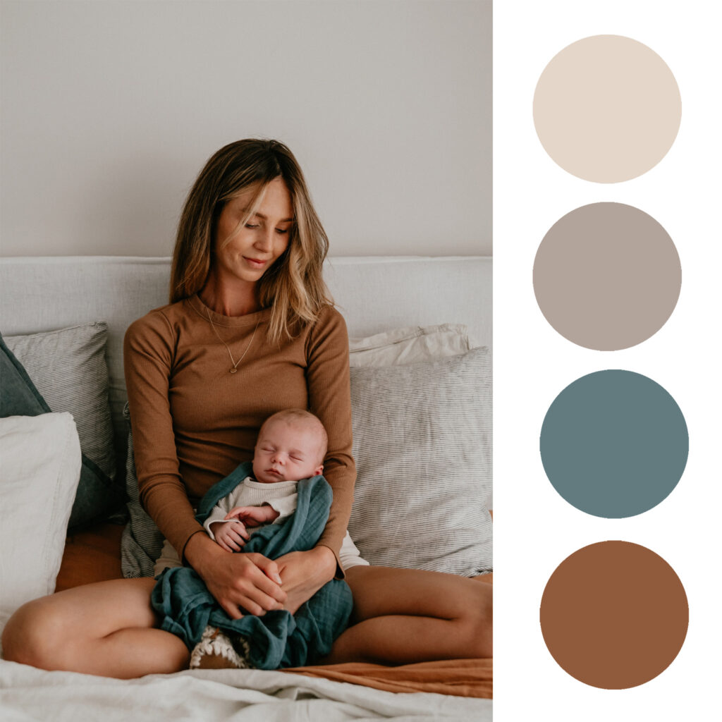A woman sits on a sofa cradling a baby, with a vertical row of four pastel color swatches on the right.